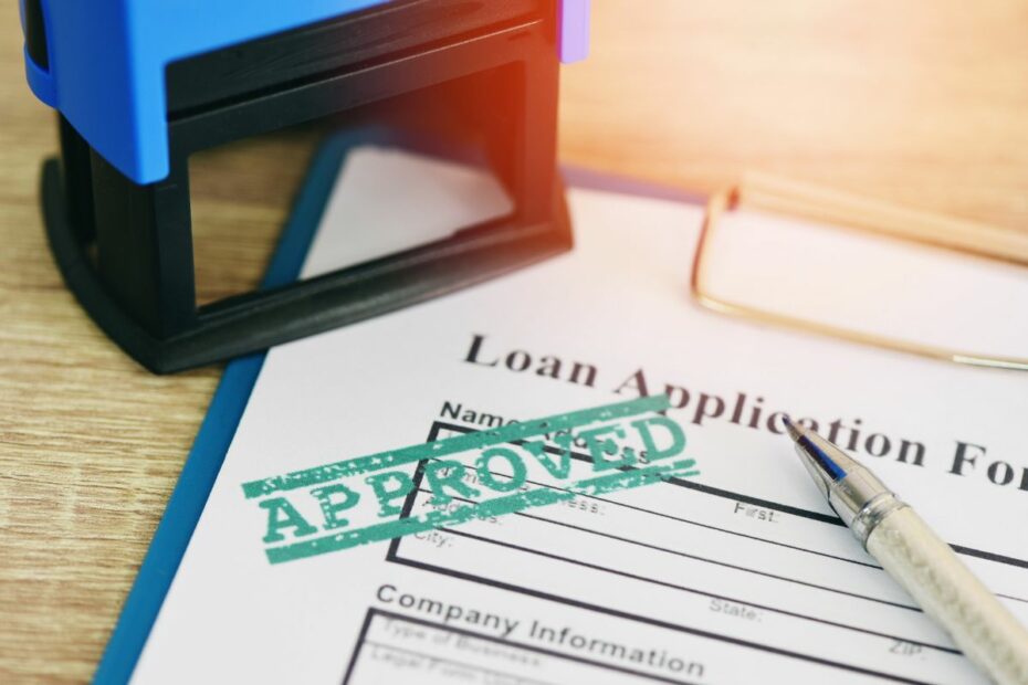 Kertas bertuliskan "Loan Application Form" dengan stempel "Approved" di atasnya.