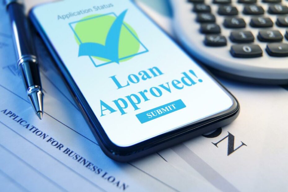 Layar handphone dengan gambar "Loan Approved".